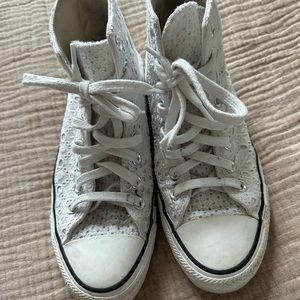 Women’s white lace Converse sneakers